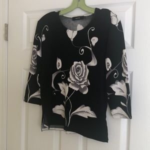Black white and gray sweater size small. The brand is KAKTUS.